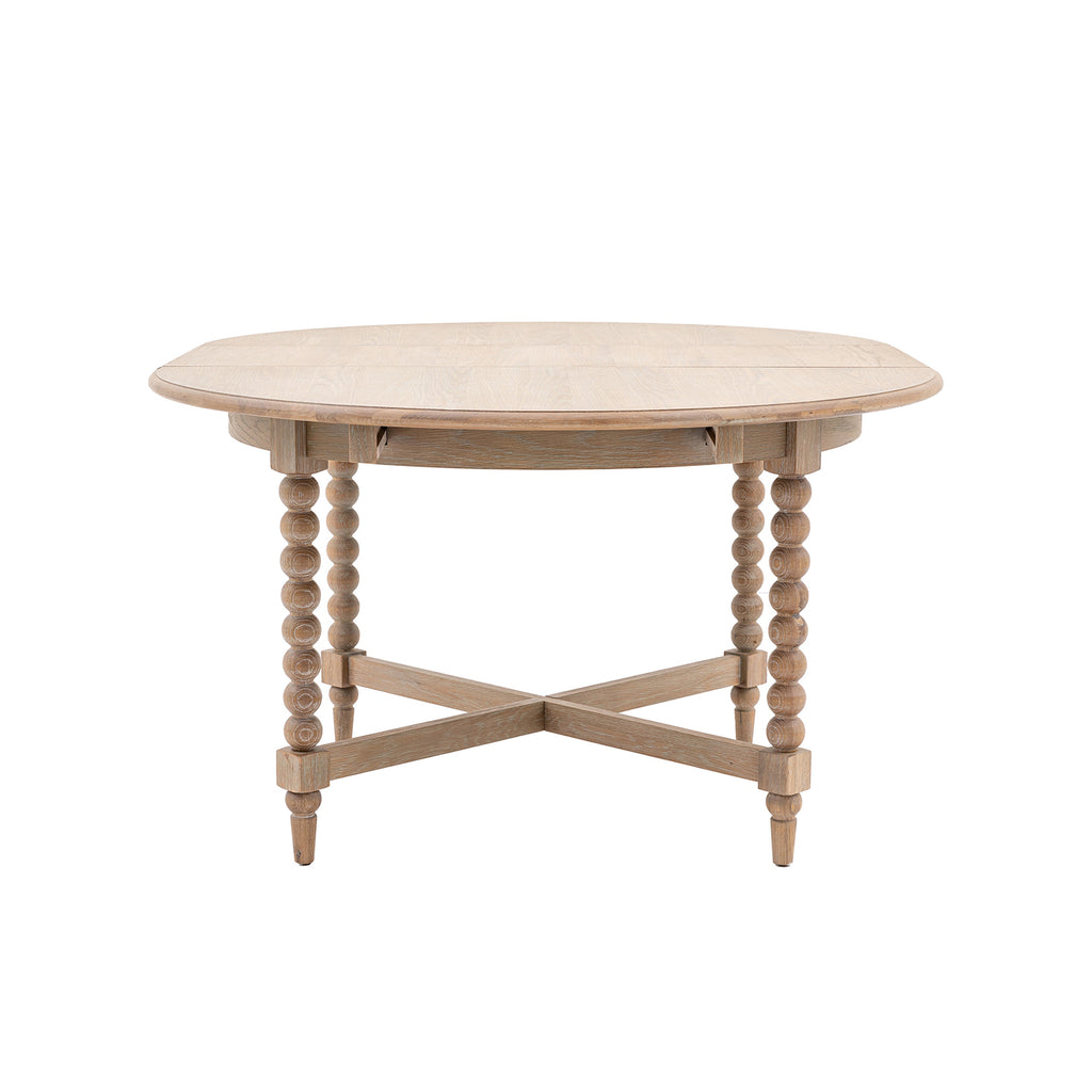 Wallingford Round Extending Dining Table in its compact circular position, showcasing the elegant wooden top and sturdy central pedestal base