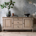 Wallingford Sideboard in a styled dining room setting with decorative items displayed on top, demonstrating its functionality as both storage and display furniture
