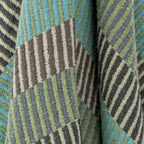 Close-up of our throw fabric with green and blue colours.