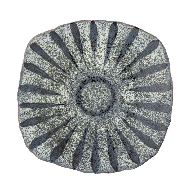 Stoneware serving plates arranged on a dining table with food