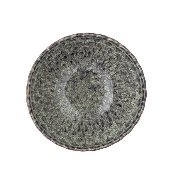 Decorative ceramic bowl with intricate patterns on a white background