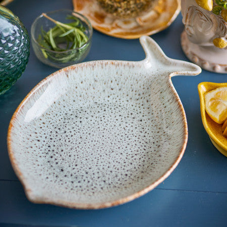 Ceramic fish plate with clean lines and a timeless design for stylish table settings.