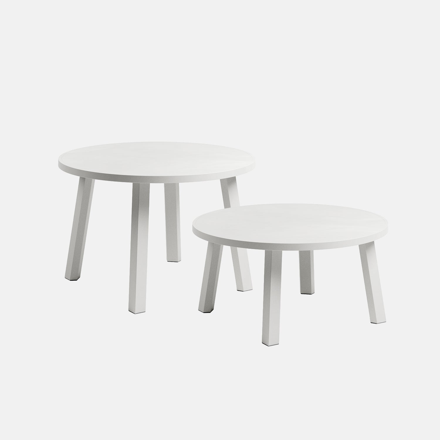 Two white round Maximo coffee tables on a light grey background