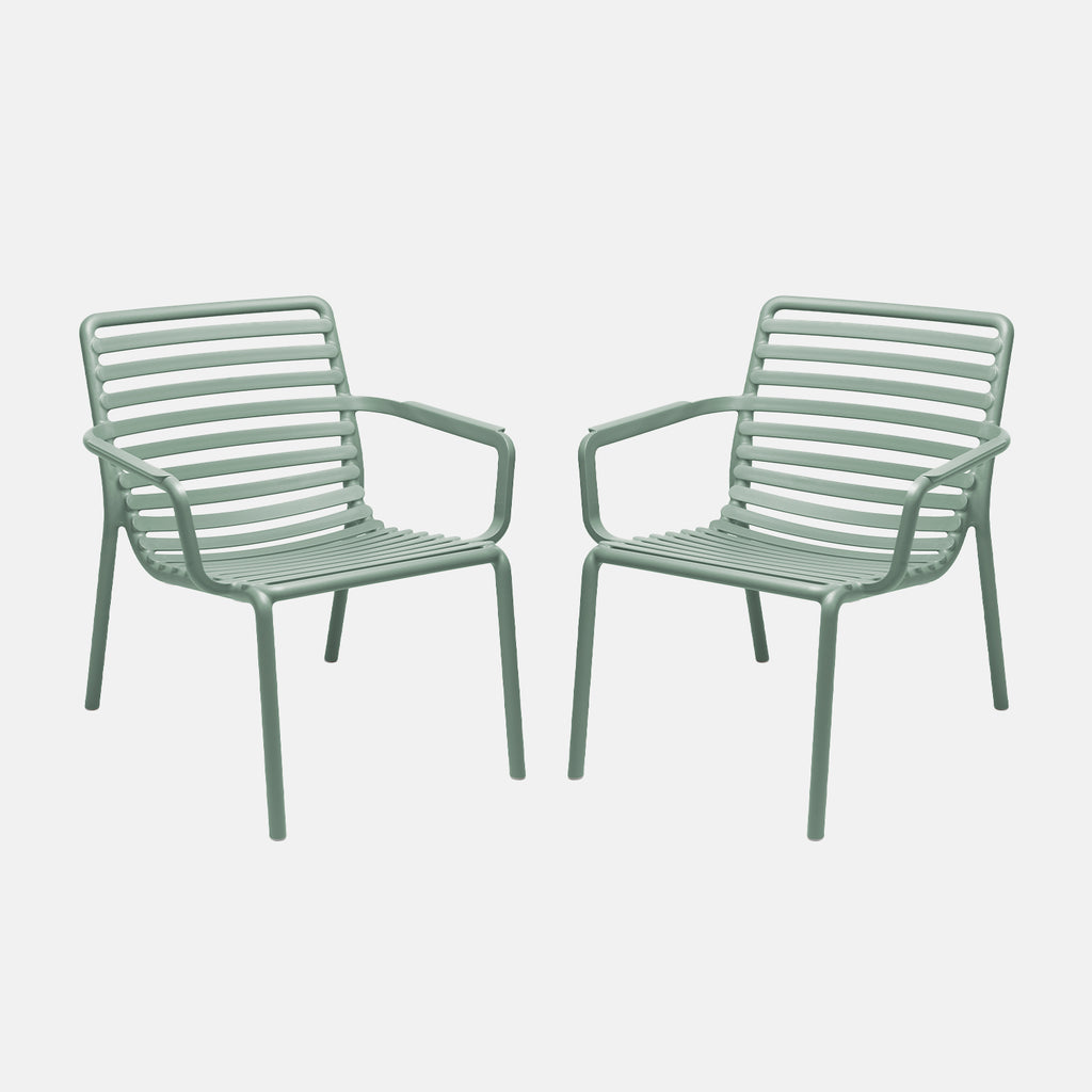 Two light mint green doga relax chairs on a white background