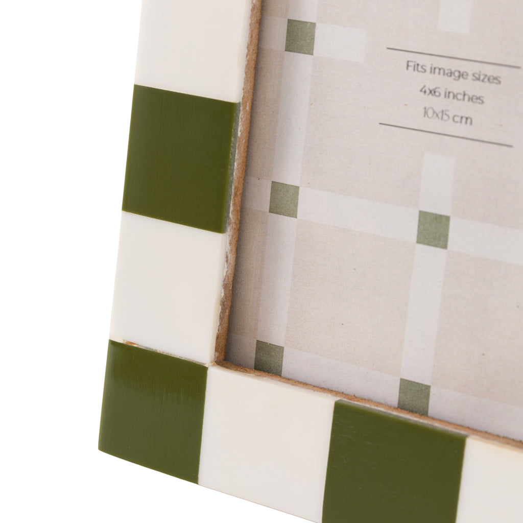 Green and white picture frame with dimensions label