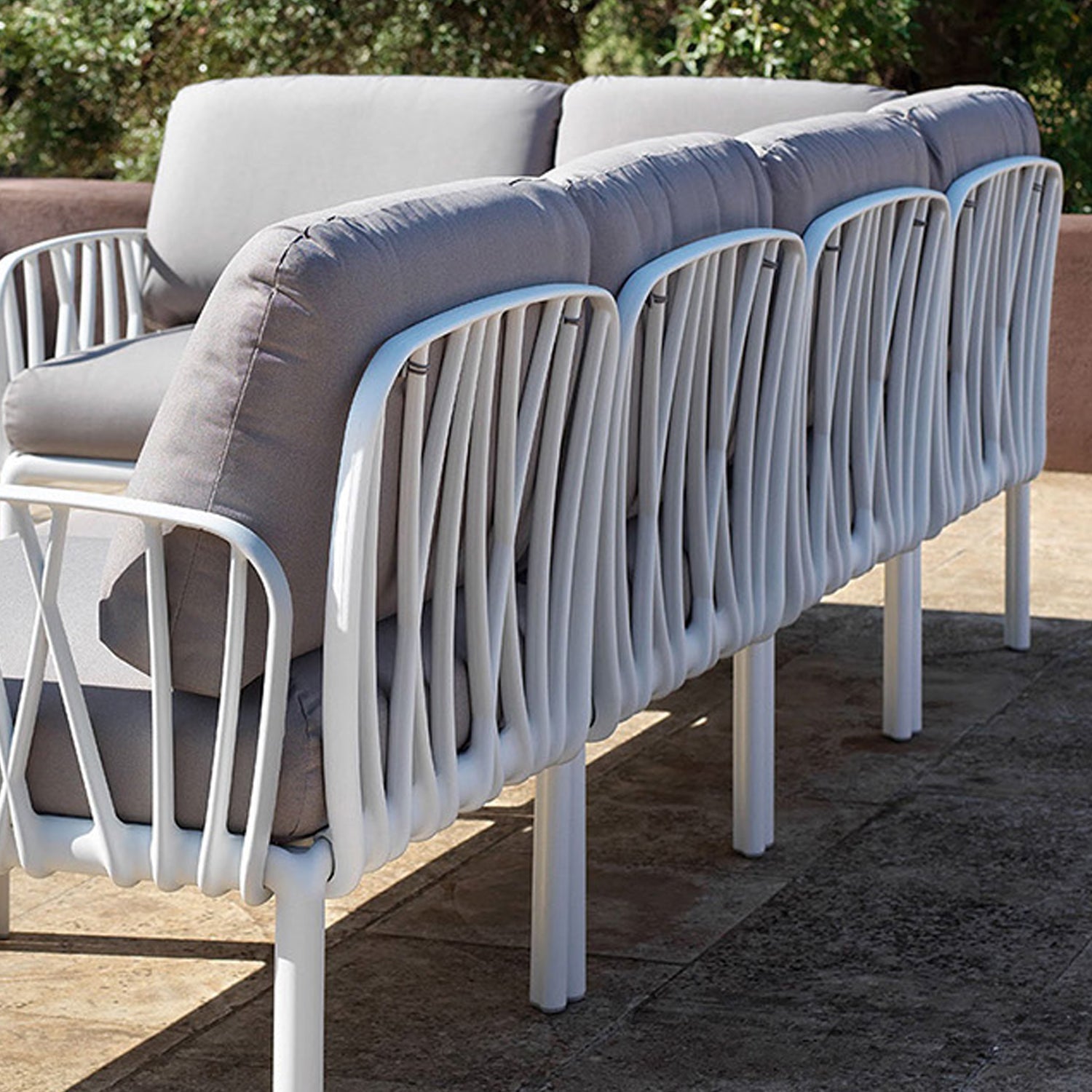 Back view of the Komodo 5 sofa. Intricate resin back panels with comfy cushions. The English Summer may be short but we're all looking forward to spending time in our beautiful gardens.