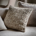 Textured pillows on a sofa with a neutral colour palette
