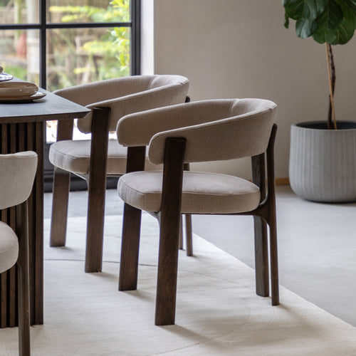Natural finish dining chair in bright interior