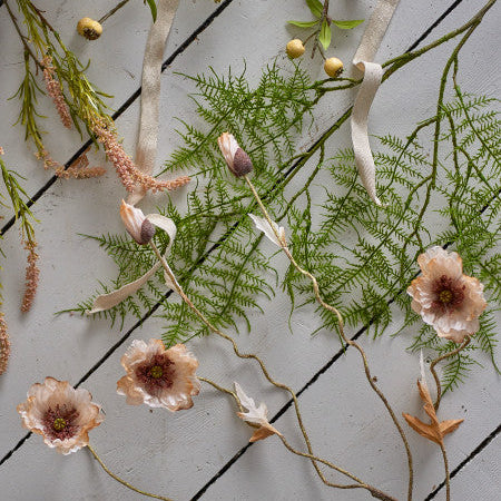 Bundle of natural stem flowers with delicate textures and muted colours