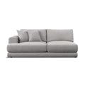 A modern low-profile sofa in light gray textured fabric, featuring two matching throw pillows, shown against a plain white background.