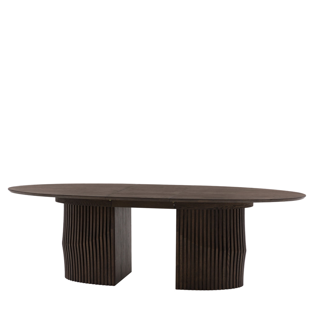 Oval table with wavy base design on a white background