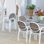 Outdoor dining area with Palma chairs and an outdoor table on a patio.