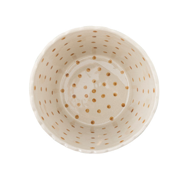 White ceramic bowl with gold polka dot pattern