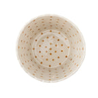 White ceramic bowl with gold polka dot pattern