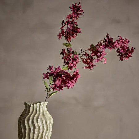 Purple Stem products styled in a modern natural home setting