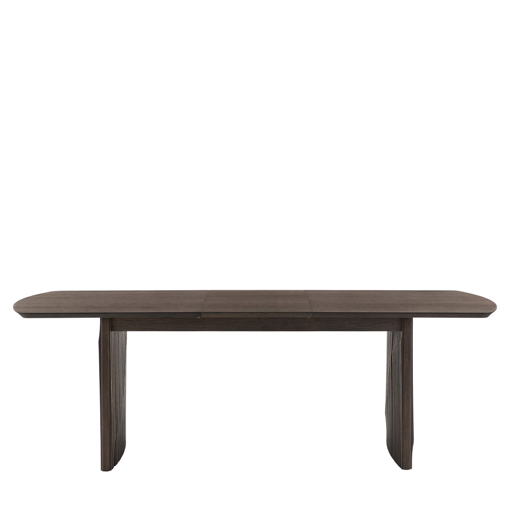 Rectangular extending dining table expanded with seating for guests
