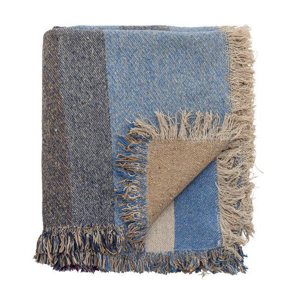 Blue throw blanket with cozy texture for sofa or bed styling.