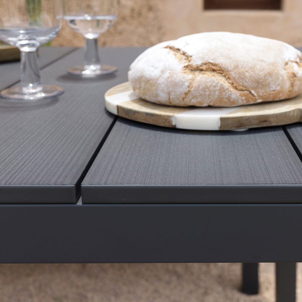 Detailed photo of the side of a Rio Alu garden table in anthracite or black finish.