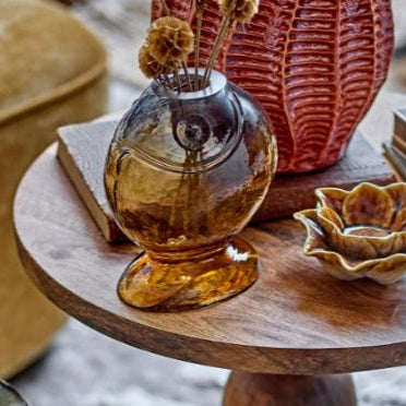 Quirky yellow fish-shaped vase displayed on a shelf