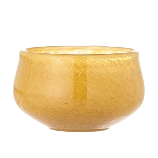 “Round yellow candle holder with smooth finish designed for table decor.