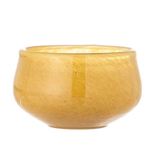 “Round yellow candle holder with smooth finish designed for table decor.