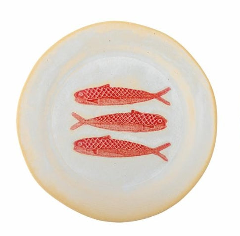 Red and white fish plate for seafood dining, perfect for visitors