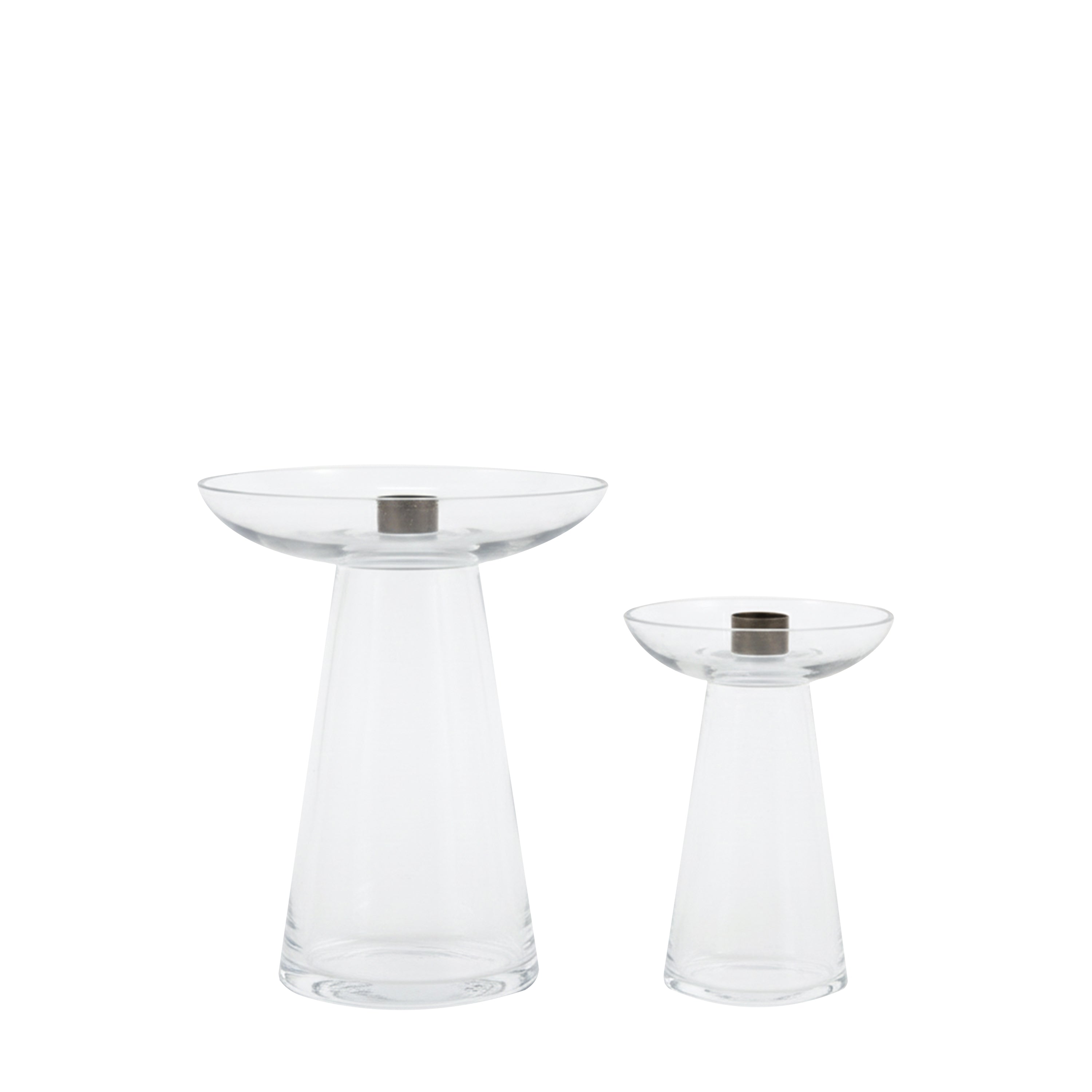 Two clear glass candle holders with metallic bases on a white background