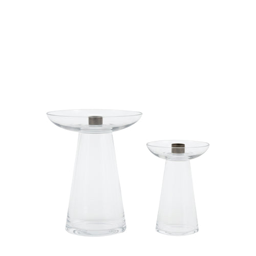 Two clear glass candle holders with metallic bases on a white background