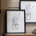 Contemporary black and white framed artwork in modern interior