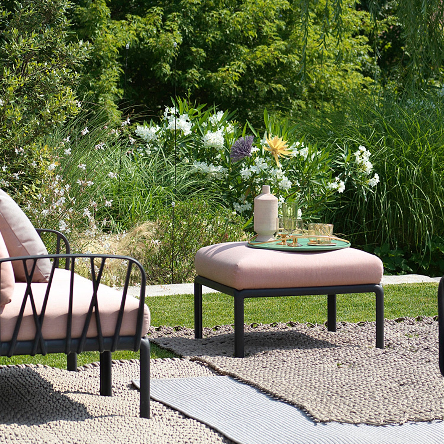 Looking for outdoor sofas in the UK? Shop our huge collection or garden items online including the Komodo 5 sofa & pouf footstool in fabric and recyclable resin.
