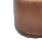 Minimalist small brown candle in glass holder
