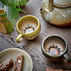 Small cups with modern design on a kitchen counter