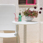 The Step garden table is small, round and can be recycled after use. It also can be customised to two height settings. The Step table pictured in 40056.00.000 with the Darsena recliner.