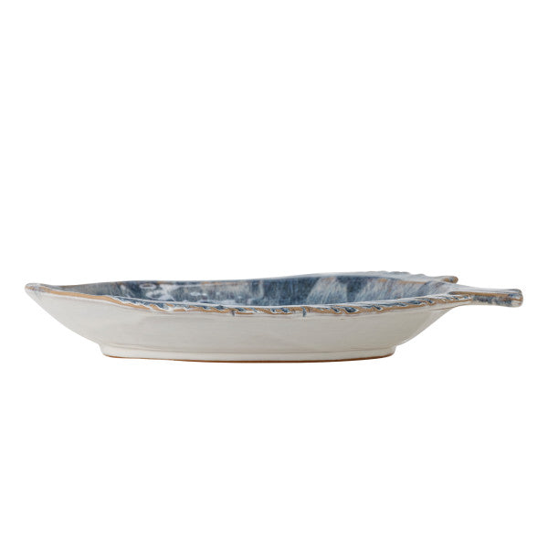 Ceramic bowl with blue marbled pattern on a white background