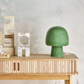 Sage green bedside lamp with soft warm light