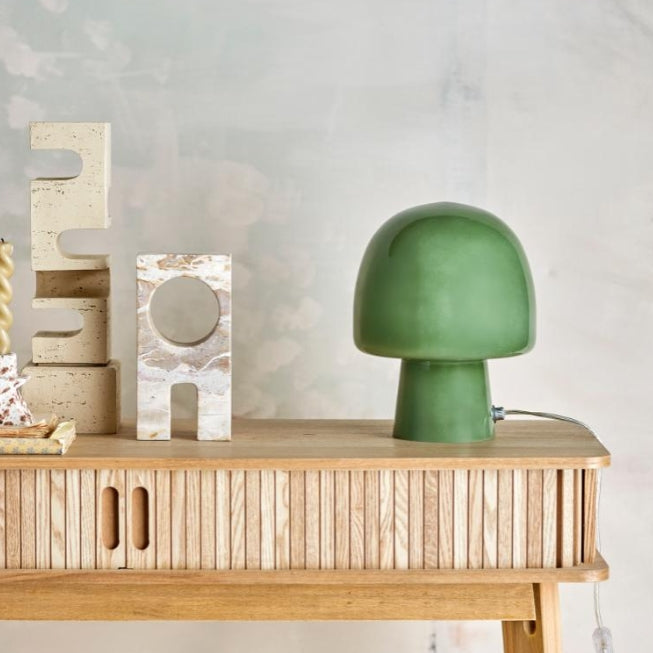 Sage green bedside lamp with soft warm light