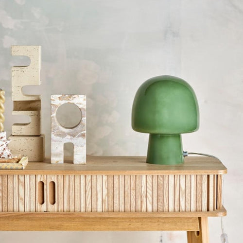 Sage green bedside lamp with soft warm light