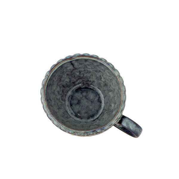 Grey cup for coffee or tea styled in a contemporary home setting