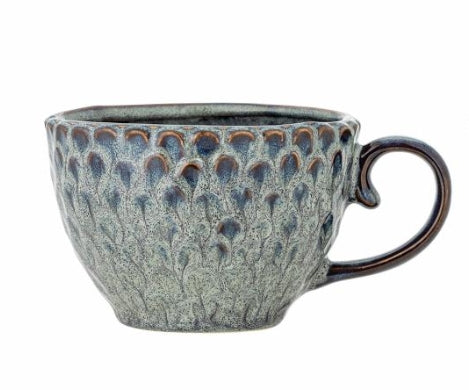 Modern grey cup placed on a table for minimalist kitchen decor