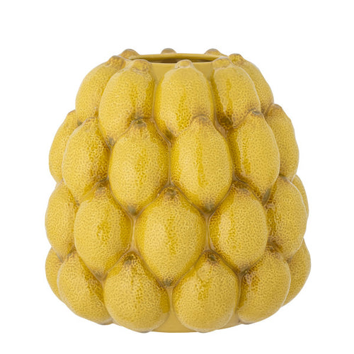 Bright yellow lemon vase adding a fresh, vibrant touch to home decor