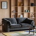 Tilly Sofa With Wooden Shelving In The Background