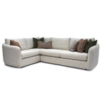  Carnaby Right Hand Facing Large Corner Sofa In Soft Boucle Oatmeal sectional sofa with patterned cushions on a white background