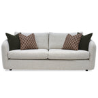 Carnaby Sofa - Large with patterned and solid brown cushions on a white background