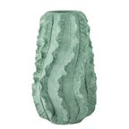 Minimalist home decor featuring a green ripple vase centrepiece