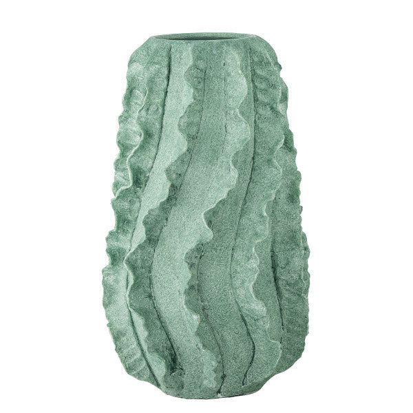 Minimalist home decor featuring a green ripple vase centrepiece