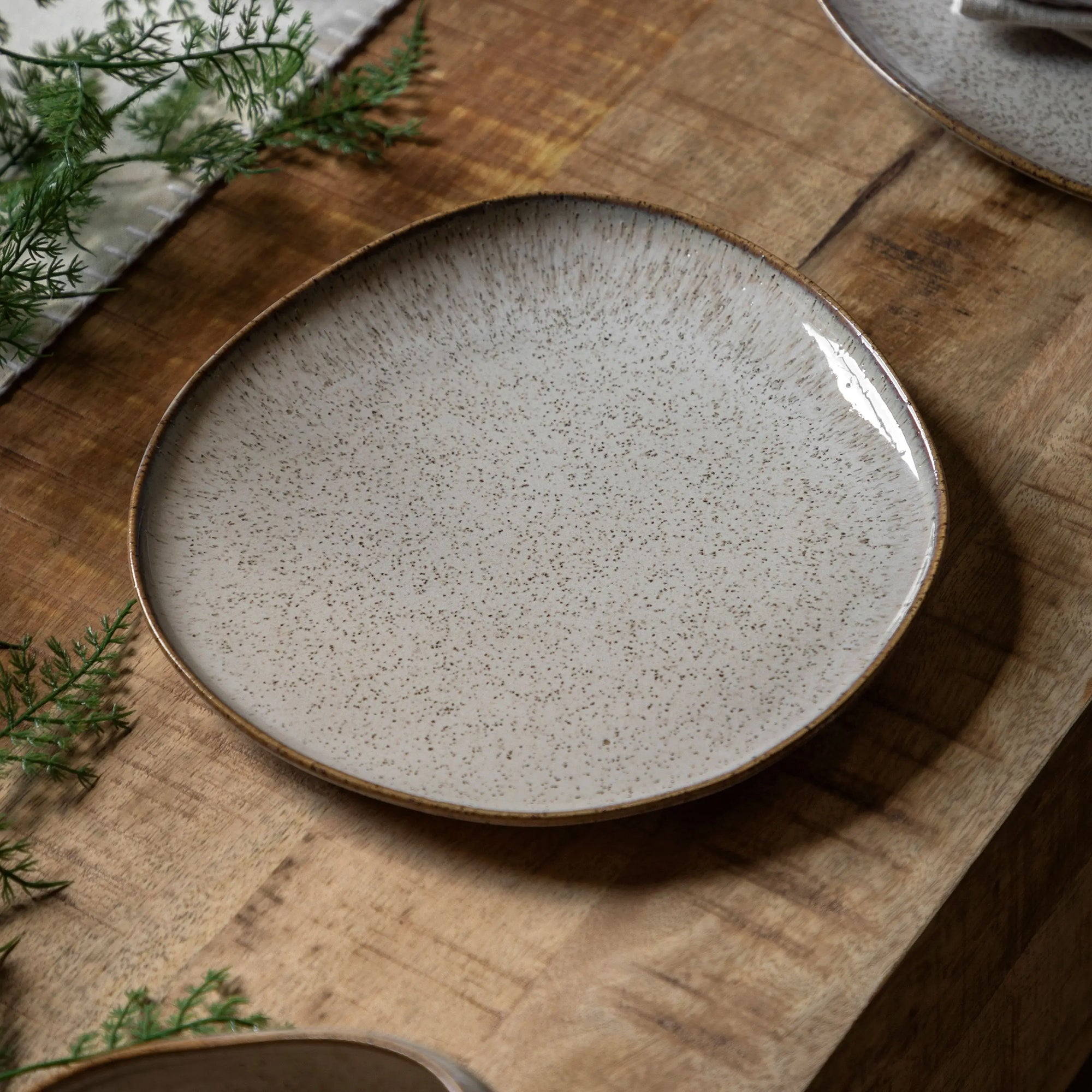 Contemporary white ceramic side plate with smooth glaze finish