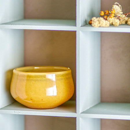 Small round yellow candle holder ideal for dining table or shelf décor