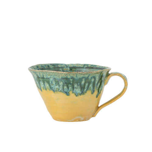 Two-tone yellow and green cup with fresh, cheerful colours