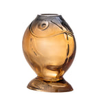 Yellow fish vase used as a playful home d√©cor piece