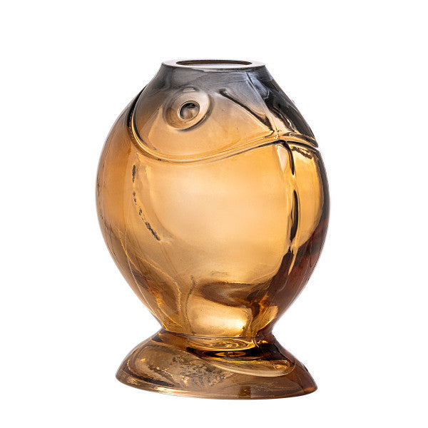 Yellow fish vase used as a playful home d√©cor piece